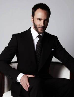Tom Ford Posing On Chair Wallpaper