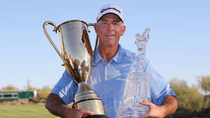 Tom Lehman Celebrating Victory With Two Trophies Wallpaper