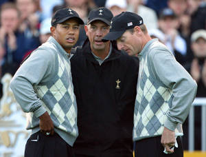 Tom Lehman Instructing Two Golfers Wallpaper