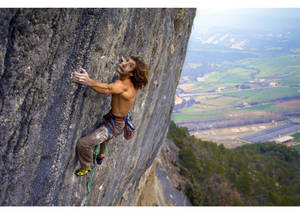 Topless Man Rock Climbing Wallpaper