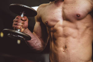 Topless Man Weightlifting Dumbbells Wallpaper