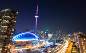 Toronto City Skyline, Illuminated Against The Night Sky Wallpaper