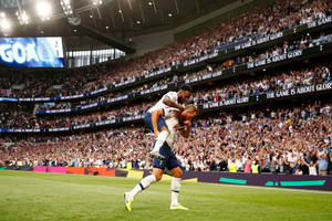 Tottenham Hotspurs Fc Players Piggy Back Wallpaper