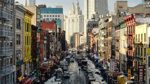 Tourists Exploring The Bustling Streets Of New York City Wallpaper