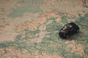 Toy Car With Countries Map Wallpaper