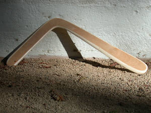 Traditional Boomerang Grounded Against A Sunrise Wallpaper