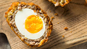 Traditional British Scotch Egg Dish In Half Slice Wallpaper