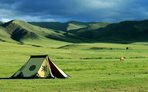 Traditional Mongolian Ger In A Picturesque Landscape Wallpaper