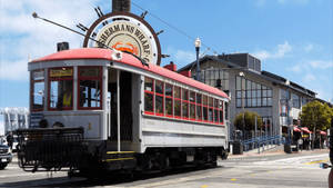 Tram Passing By Fishermans Wharf Wallpaper