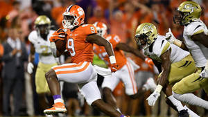 Travis Etienne Protecting The Ball Wallpaper