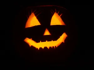 Trick Or Treat - Celebrate Halloween With A Black Pumpkin Wallpaper