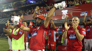 Triumph Of Team Spirit: Punjab Kings In Action Wallpaper