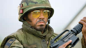 Tropic_ Thunder_ Character_ With_ Gun Wallpaper