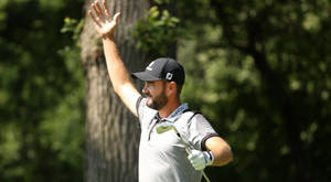 Troy Merritt Holding His Arm Up Wallpaper