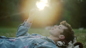 Troye Sivan With Sunrise Wallpaper