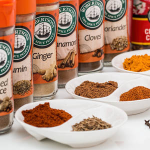 Turmeric Powder Bottle And Other Spices Wallpaper