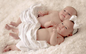 Twin Joy - Newborn Babies Sleeping Peacefully Wallpaper