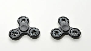 Two Black Fidget Toys Wallpaper