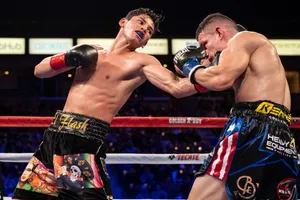 Two Boxers In A Boxing Ring Fighting Wallpaper
