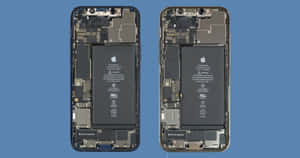 Two Iphones With The Battery And The Motherboard Wallpaper