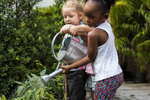 Two Little Girls Gardening Wallpaper