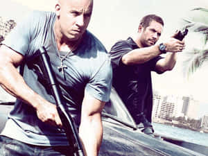 Two Men Standing Next To A Car With Guns Wallpaper