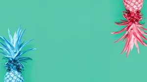 Two Pineapples On A Turquoise Background Wallpaper