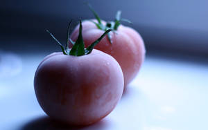 Two Pink Frozen Tomato Fruits Wallpaper