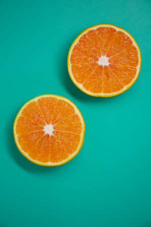 Two Slices Of Orange Iphone Wallpaper