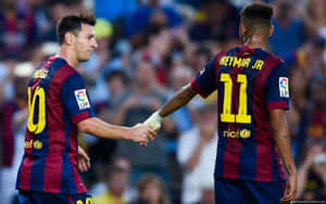 Two Soccer Players Shaking Hands In Front Of A Crowd Wallpaper