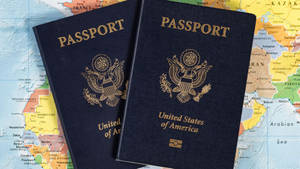 Two Usa Passport On World Map Wallpaper