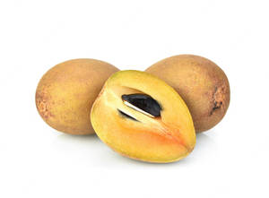 Two Whole Sapodilla Fruits And Half Wallpaper