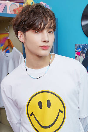 Txt Huening Kai In Smiley Shirt Wallpaper