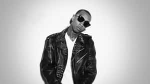 Tyga Rap Star Rocking The Red Hat On Stage Wallpaper