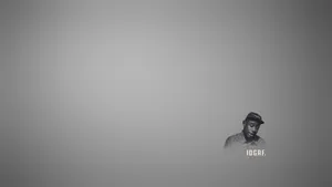 Tyler The Creator On A Dark Gray Background Wallpaper