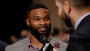 Tyron Woodley In Light Grey Suit Wallpaper