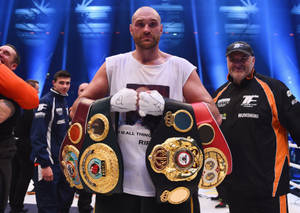 Tyson Fury Displays His Boxing Belts Wallpaper