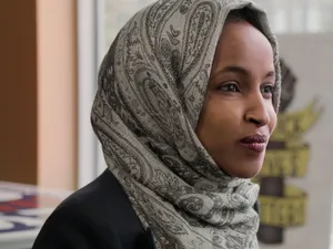 U.s. Representative Ilhan Omar With A Sparkling Gaze Wallpaper