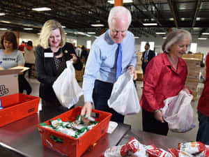 U.s. Senator John Cornyn Seen Packing Relief Goods Wallpaper