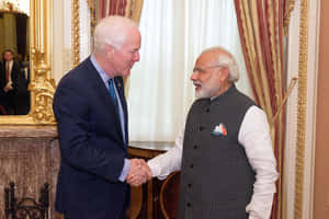 U.s. Senator John Cornyn Shaking Hands With Constituent Wallpaper