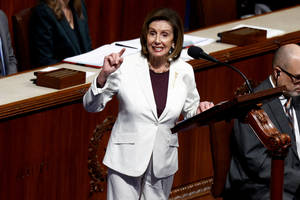 U.s. Speaker Of The House Nancy Pelosi In A Chic White Pantsuit Wallpaper