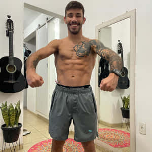 Ufc Fighter Matheus Nicolau Performing A Front Lat Spread Wallpaper