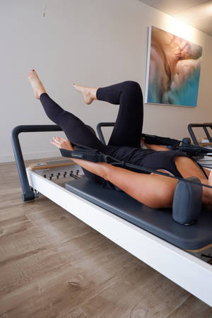 Unique Woman In Pilates Wallpaper