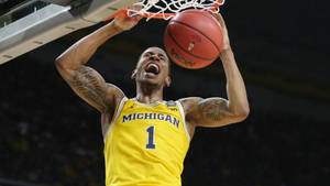 University Of Michigan-ann Arbor Basketball Dunk Wallpaper