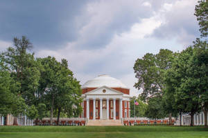 University Of Virginia's Historic Rotunda Under Cloudy Sky Wallpaper