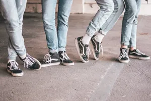 Urban Vibes With Black Vans Old Skool Sneakers Wallpaper