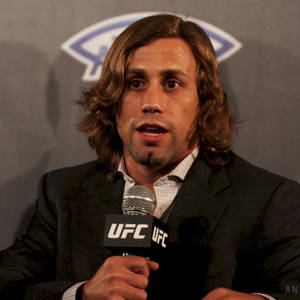 Urijah Faber Holding A Ufc Microphone Wallpaper