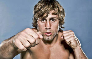 Urijah Faber Posing And Punching Wallpaper