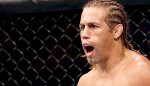 Urijah Faber Yelling In The Ring Wallpaper