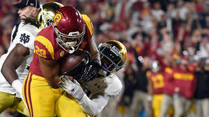 Usc Football Player Tackled Wallpaper